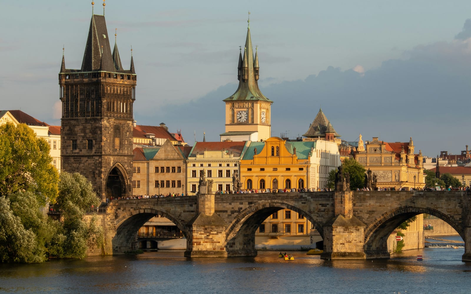 Charles Bridge over the Vltava and the Old Town Bridge Tower in late-afternoon light